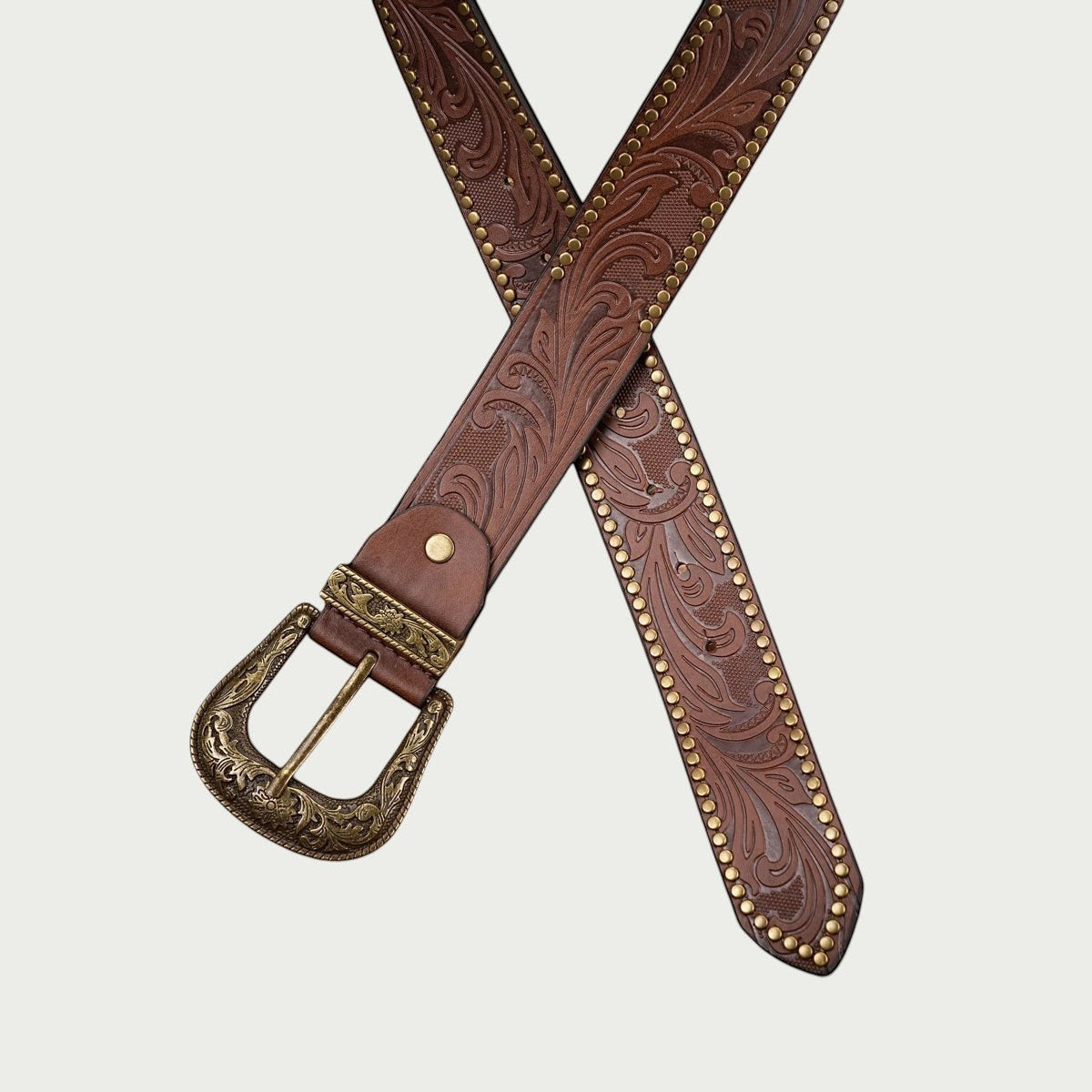 Ceinture Ceintura Concordia brun rouge croisée avec sa boucle western dorée et son passant gravé