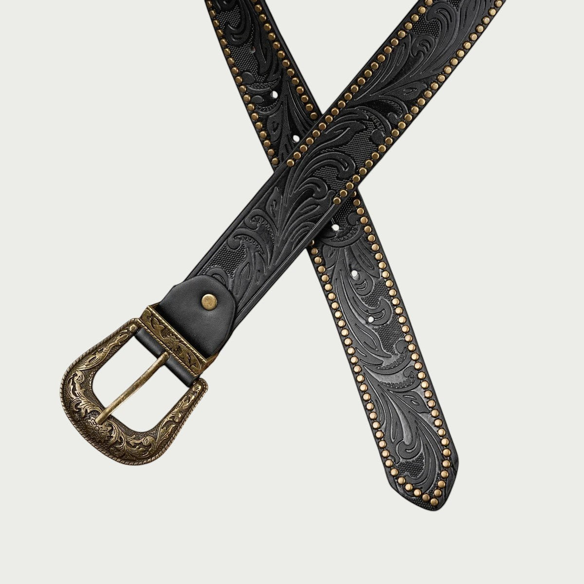 Ceinture Ceintura Concordia noire croisée avec boucle western dorée gravée et bordure cloutée