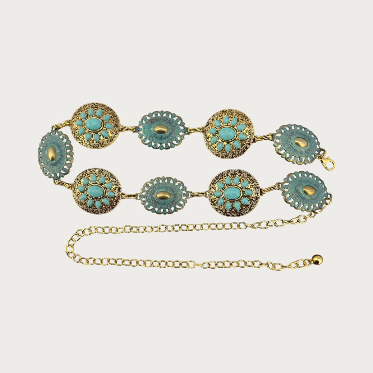 Ceinture chaîne Ceintura à médaillons dorés et cabochons turquoise présentée en double rang avec sa chaînette