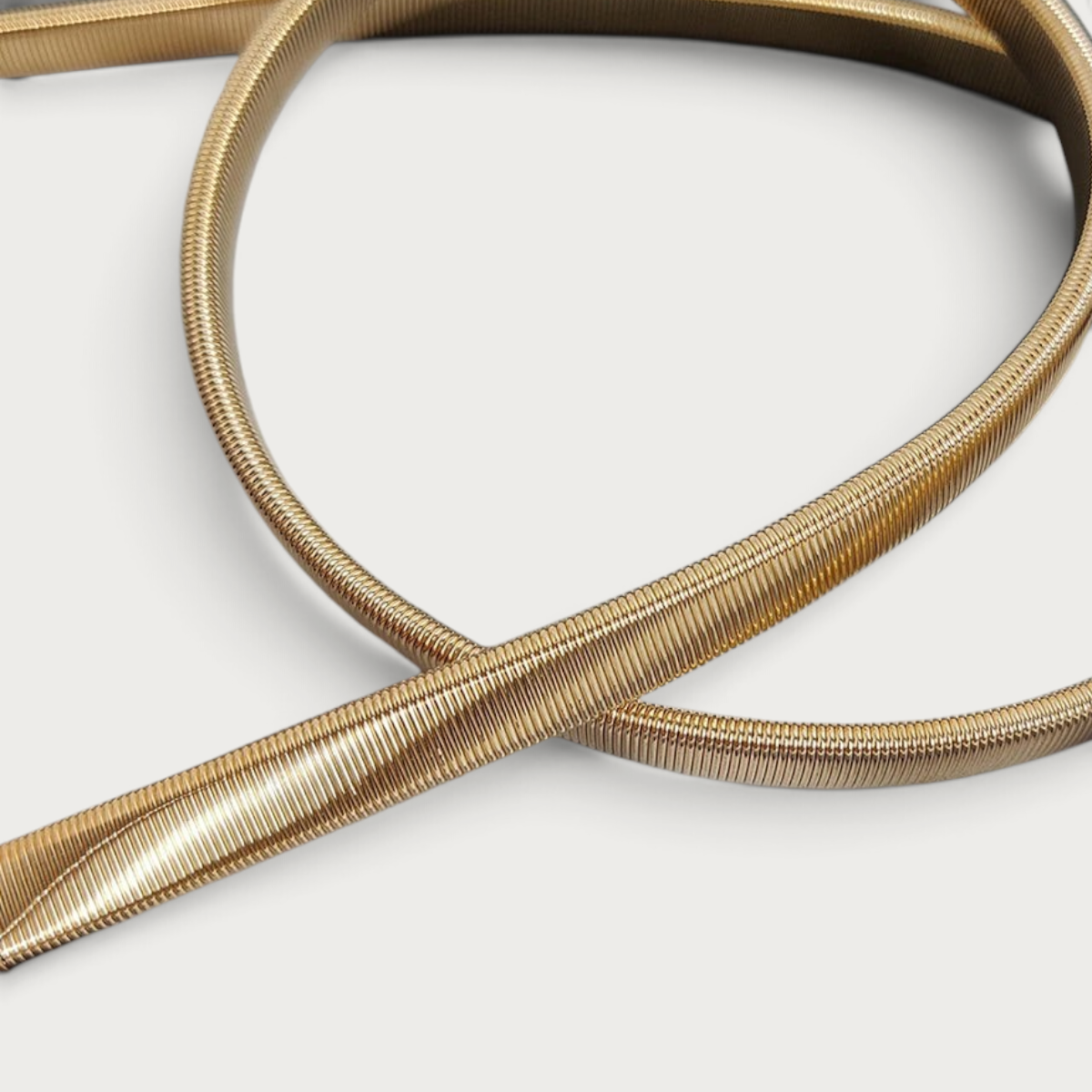 Ceinture bijoux élastique Ceintura Cefalù fine et souple avec une finition métallique dorée brillante