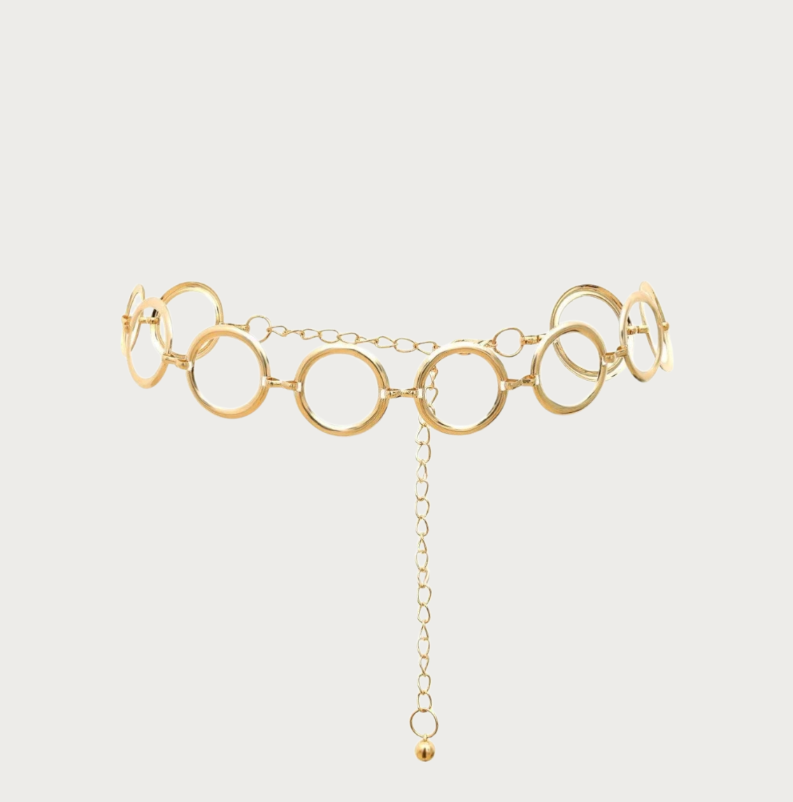 Ceintura ceinture chaîne dorée pour femme composée de grands anneaux métalliques circulaires au style punk chic