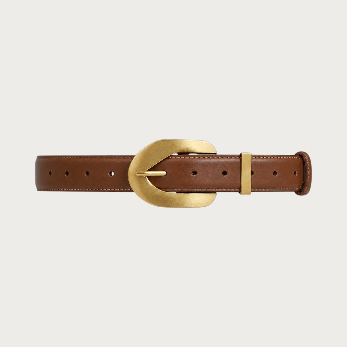 Ceinture Ceintura en cuir cognac déployée à plat, grosse boucle ardillon dorée en U et passant assorti