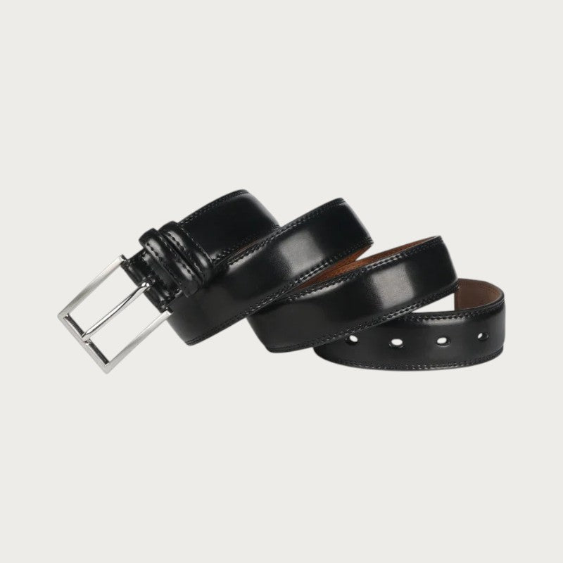 Ceinture Ceintura Brindisi en cuir noir enroulée souplement, boucle ardillon argentée et trous de réglage