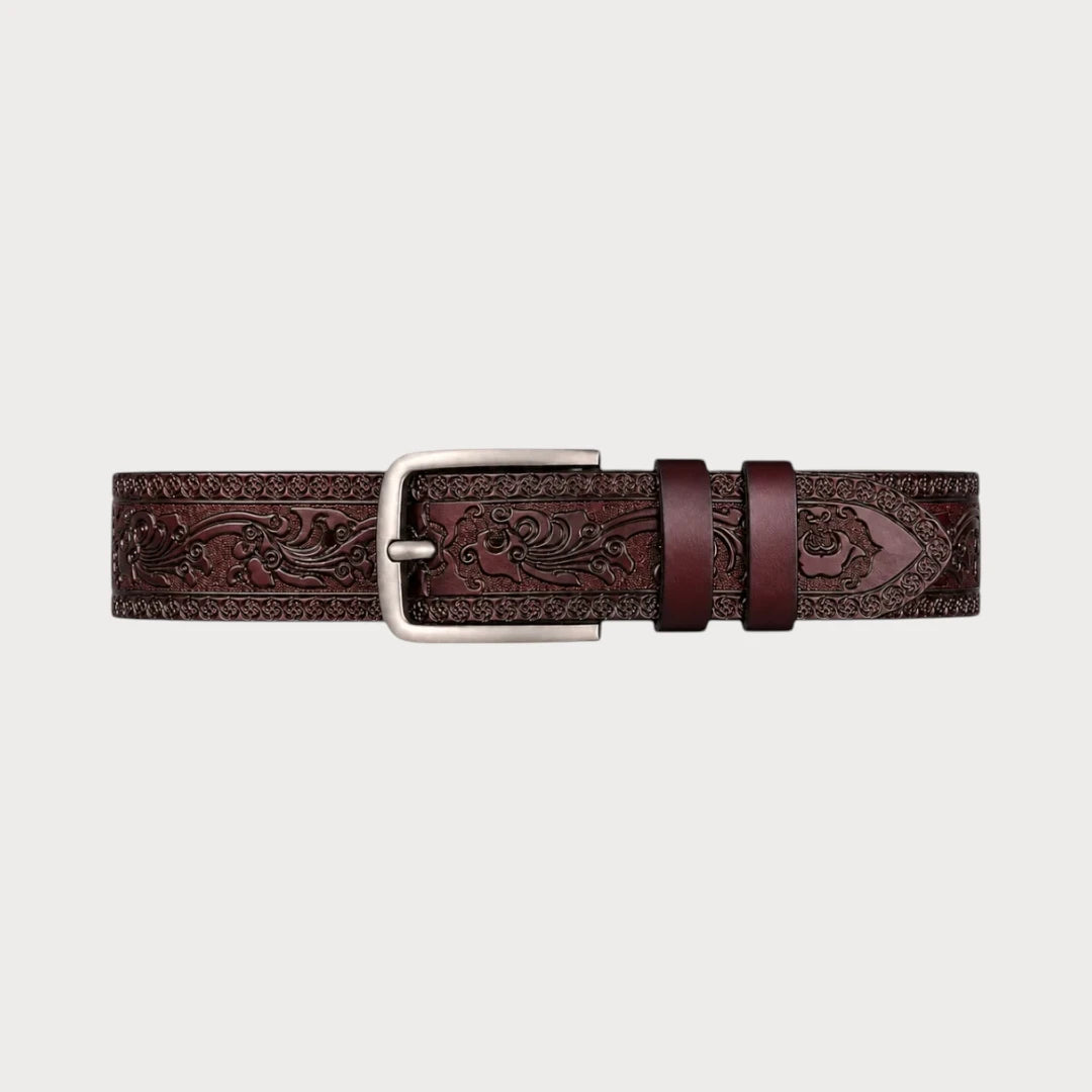 Ceinture Ceintura en cuir marron gravé de motifs floraux western déployée à plat, boucle ardillon argentée