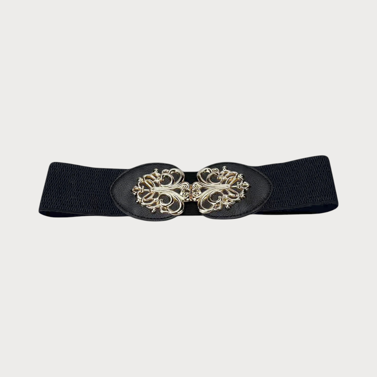 Gros plan sur la boucle dorée ajourée à motif floral de la ceinture élastique Ceintura noire