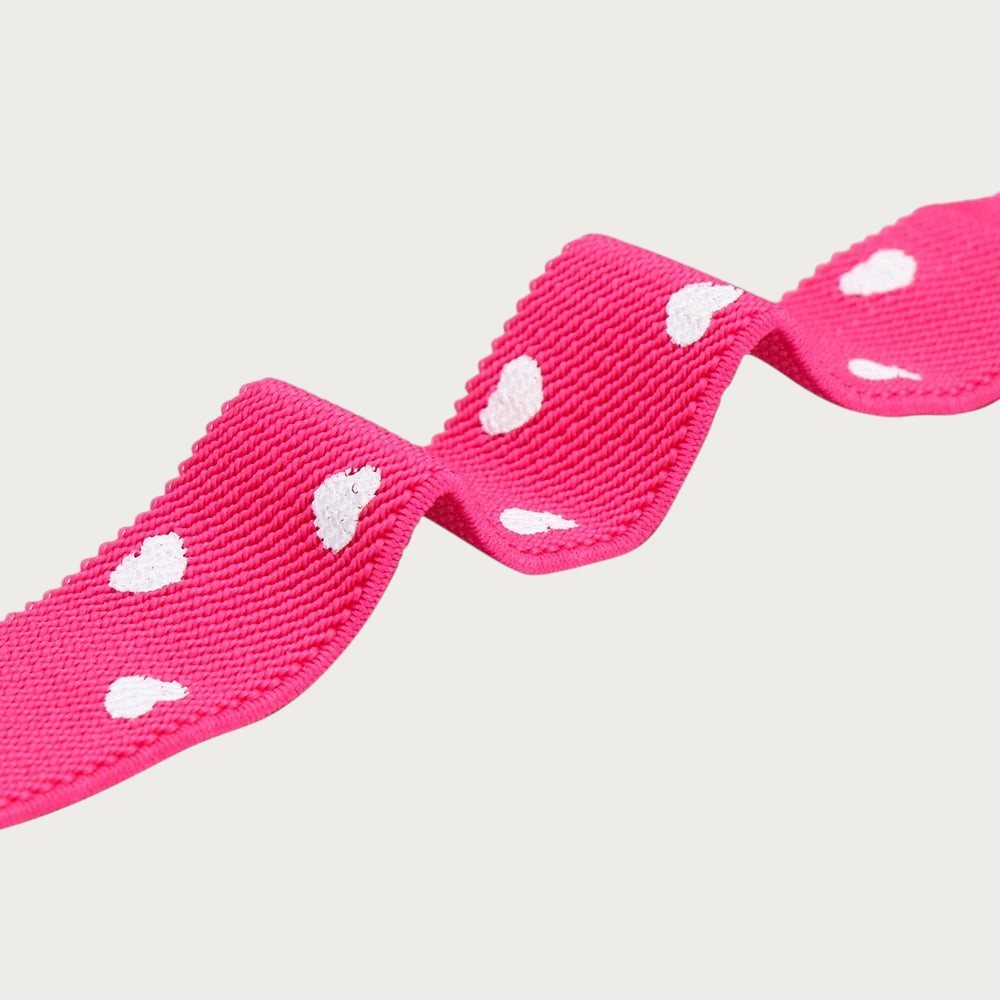 Ceintura ceinture élastique rose pour fille avec motif de petits cœurs blancs, accessoire de mode extensible.