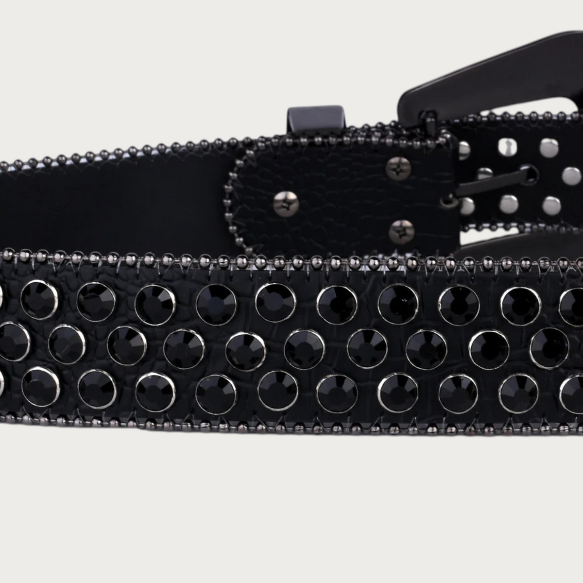 Ceinture Ceintura noire en similicuir ornée de deux rangées de strass noirs et de clous métalliques