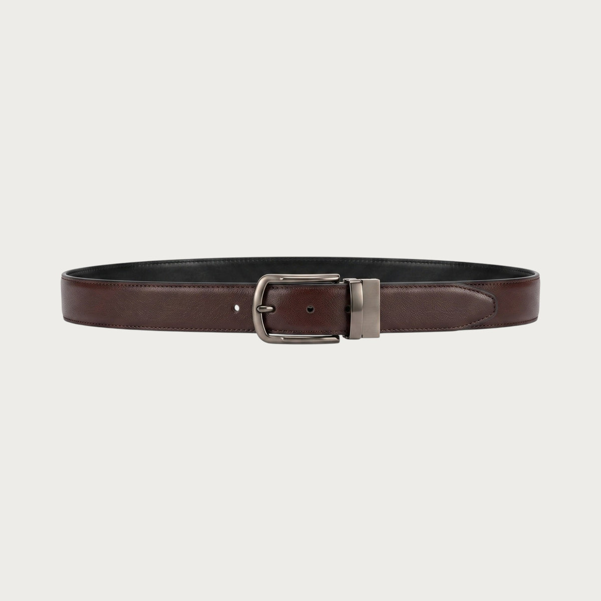 Ceinture réversible Ceintura Dante déployée à plat, face marron et face noire, boucle rotative gris acier